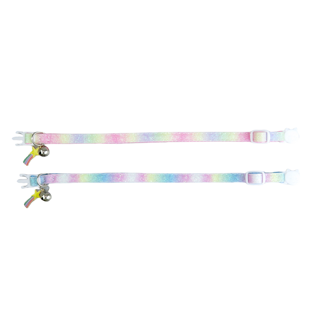 Pink and blue gradient cat collars laid flat to show the adjustable straps