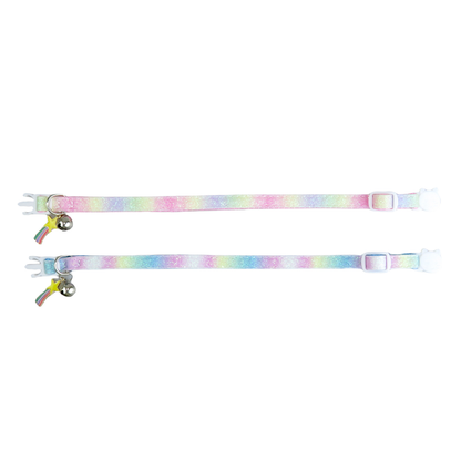 Pink and blue gradient cat collars laid flat to show the adjustable straps