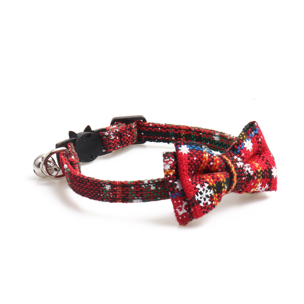 Red plaid bow cat collar with bell, angled view