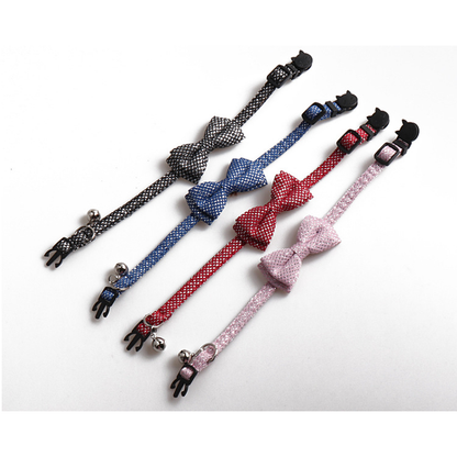 Four silver-dot bow cat collars displayed in black, blue, red and light pink