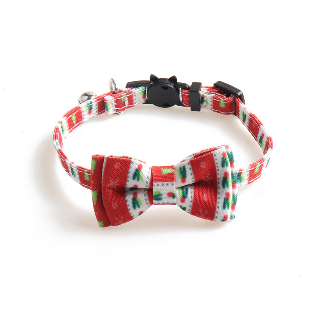 Red patterned cat collar with bow, bell and cat-face buckle, front view