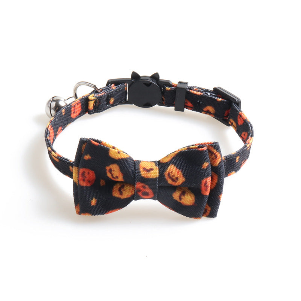 Black pumpkin-print cat collar with bow, bell and cat-face buckle
