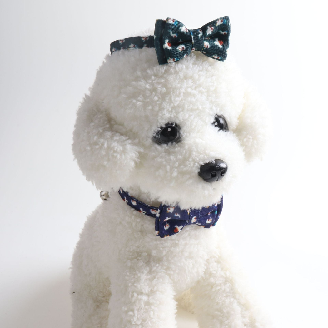 Ghost-print bow cat collars styled on a white plush dog model