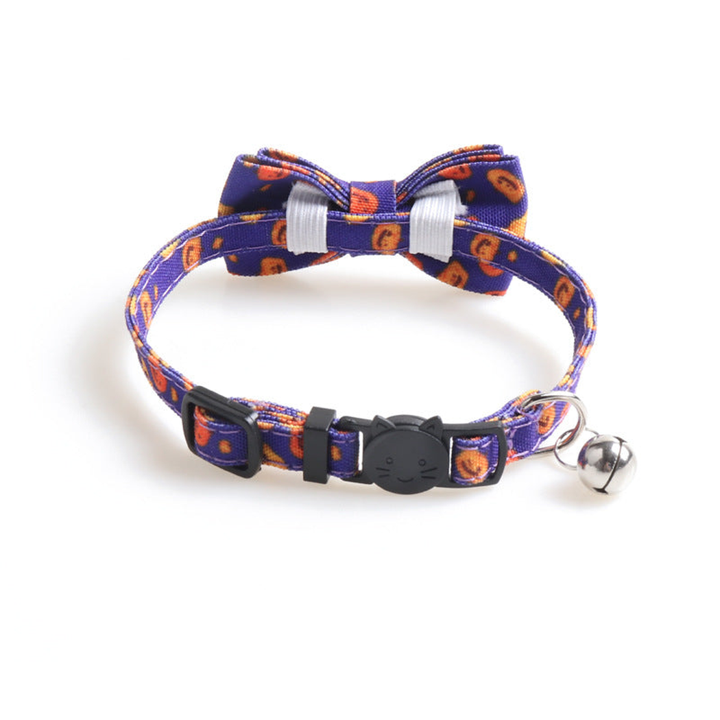 Rear detail of a purple pumpkin-print bow cat collar with attachment loops and bell