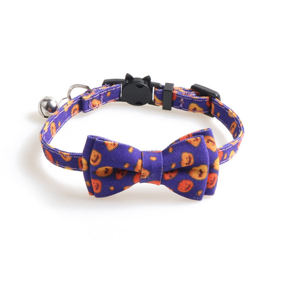 Purple pumpkin-print cat collar with bow, bell and cat-face buckle