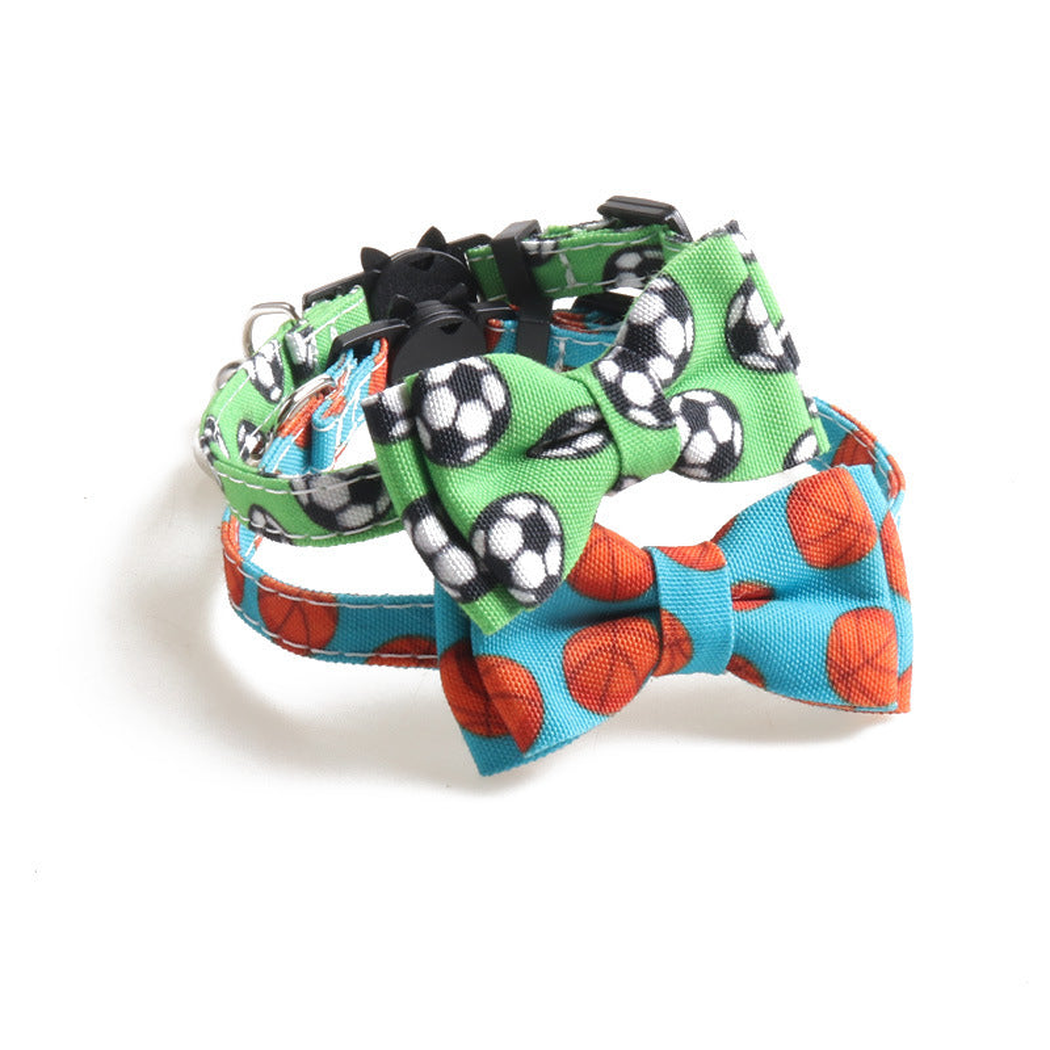 Soccer and basketball print bow cat collars displayed together