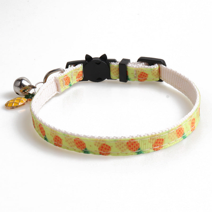 Pale yellow pineapple-pattern cat collar with cat-face buckle, bell and pineapple charm