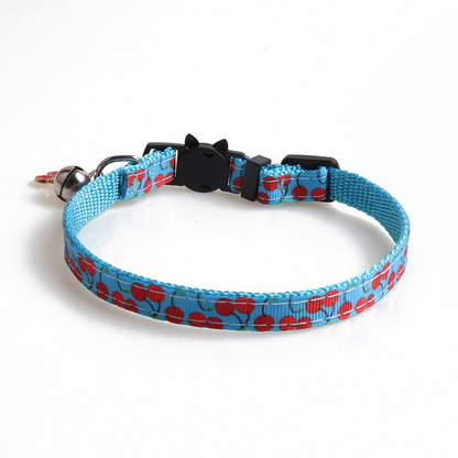 Light blue cherry-pattern cat collar with cat-face buckle, bell and cherry charm