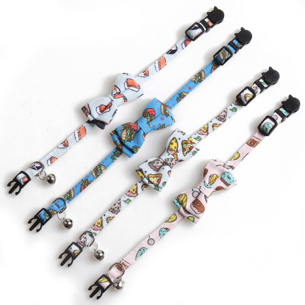 Four food-print bow cat collars laid flat to show their adjustable bands