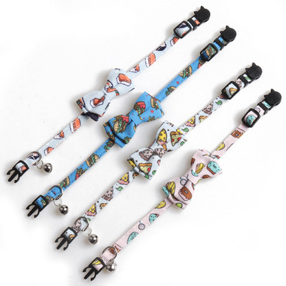 Four food-print bow cat collars laid flat to show their adjustable bands