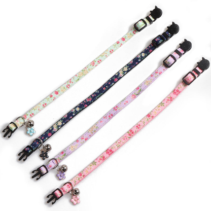 Four floral cat collars laid flat to show their full adjustable straps