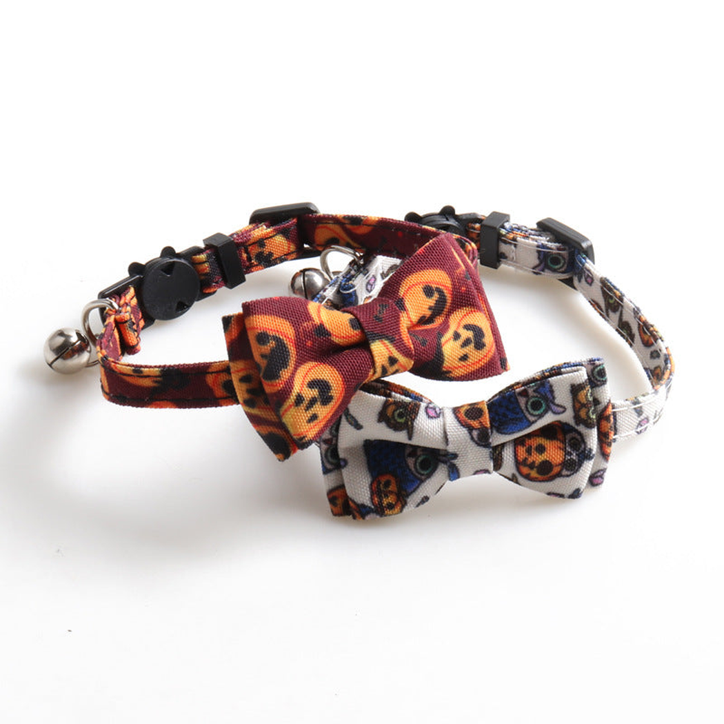 Orange pumpkin and white owl-print bow cat collars displayed together