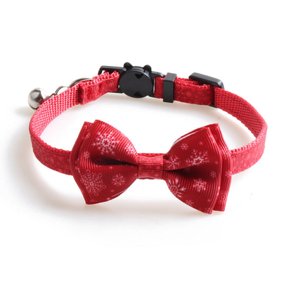 Red snowflake-pattern bow cat collar with bell and cat-face clasp