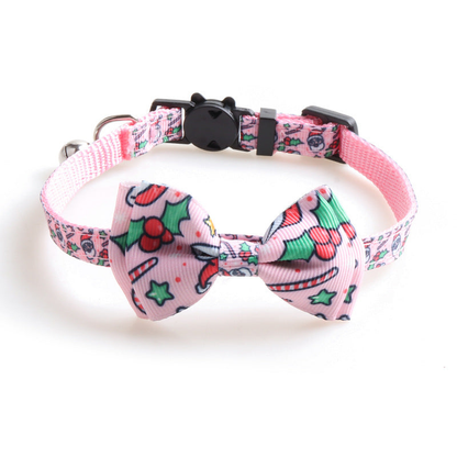 Light pink Santa and candy cane-pattern bow cat collar with bell and cat-face clasp