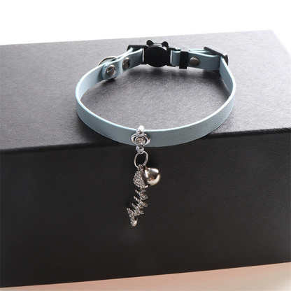 Light blue cat collar with bell and dangling fishbone charm