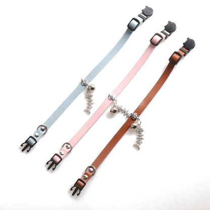 Light blue, light pink and brown cat collars displayed at full length
