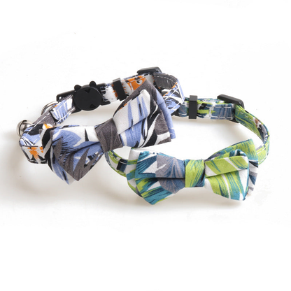 Blue-gray and green leaf-print bow cat collars displayed together