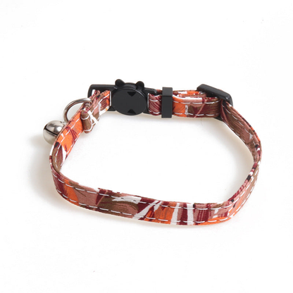 Orange-red leaf-print cat collar without a bow, with bell and cat-face buckle