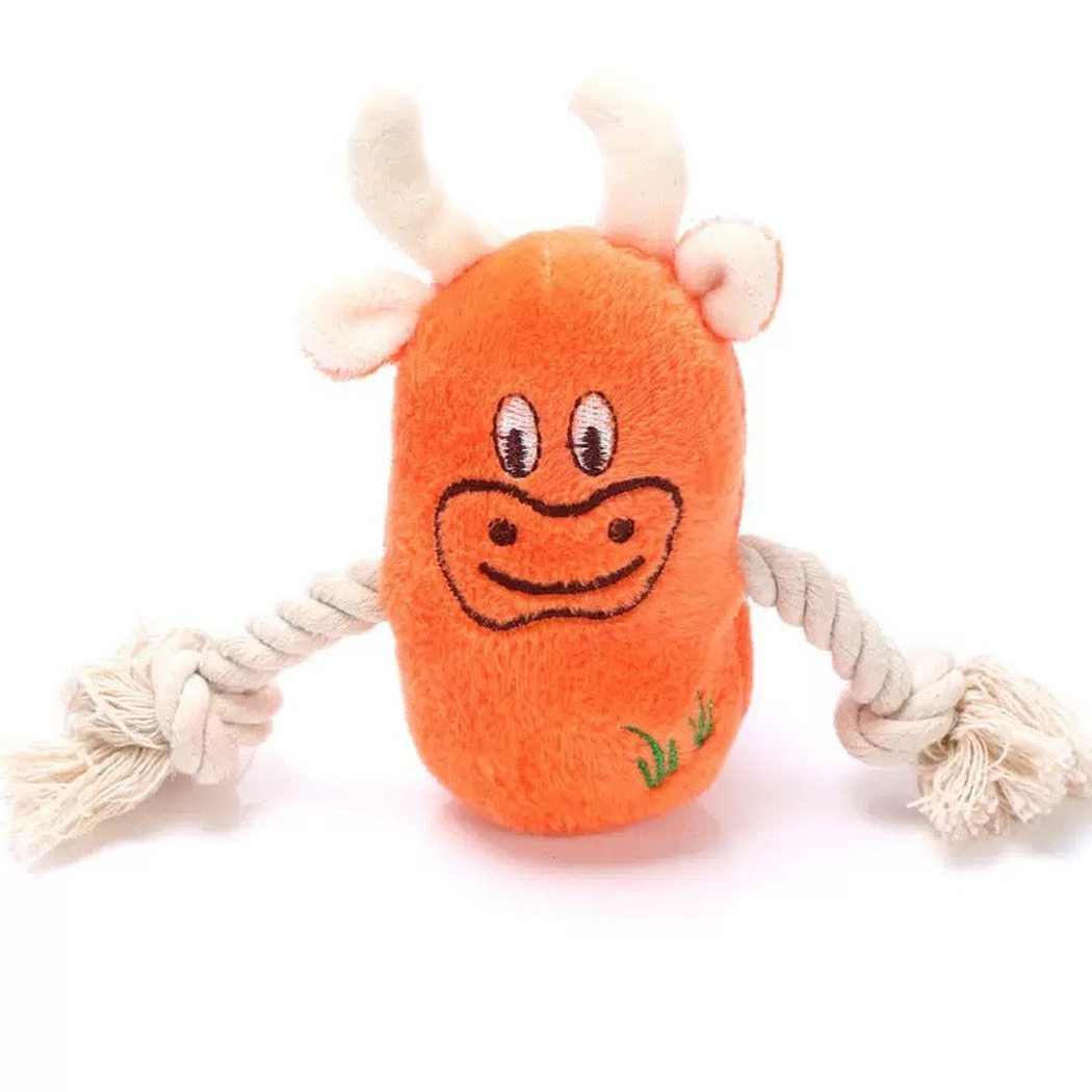 Orange cow character dog toy with knotted rope arms, front view
