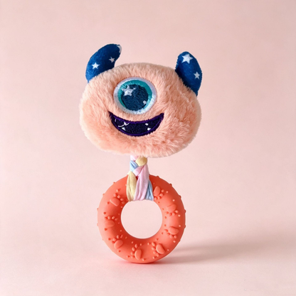 Orange one-eyed monster-face ring dog toy, front view