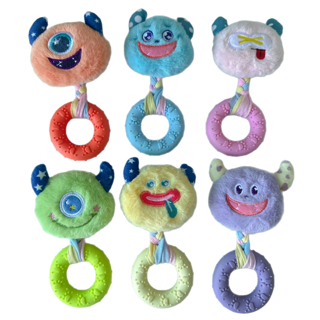 Six colorful monster-face ring dog toy styles on a white background