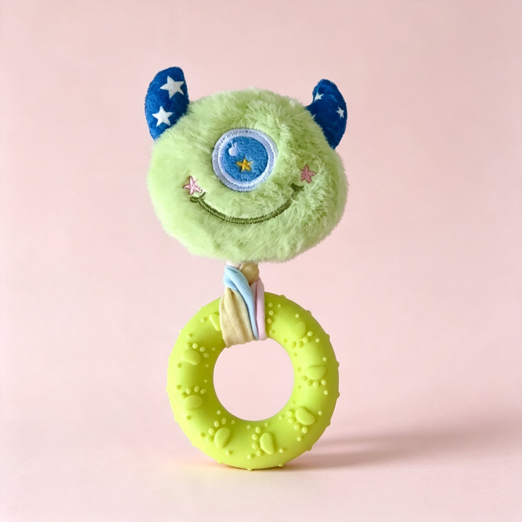 Green one-eyed monster-face ring dog toy, front view
