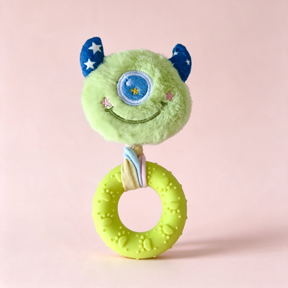 Green one-eyed monster-face ring dog toy, front view