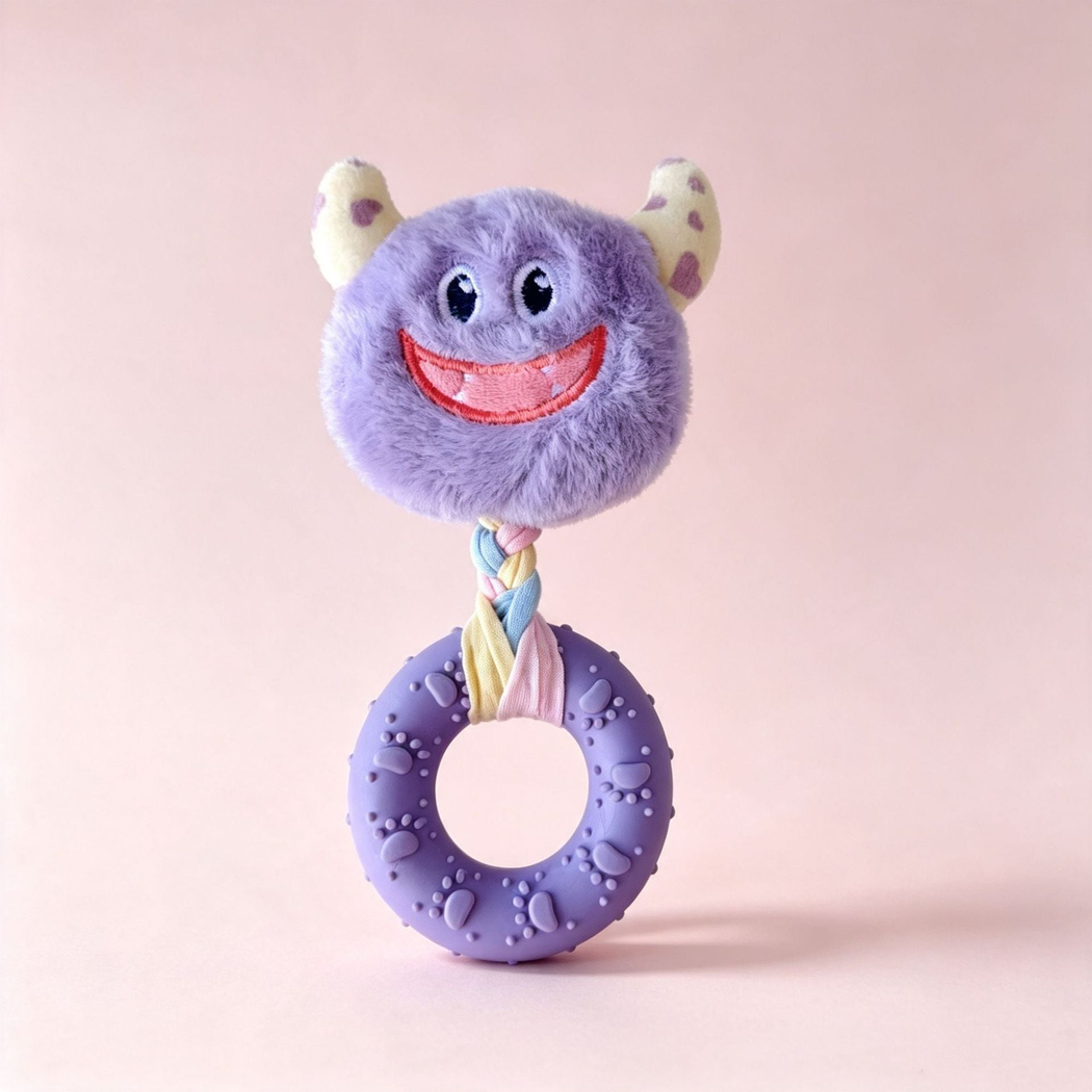Light purple smiling monster-face ring dog toy, front view