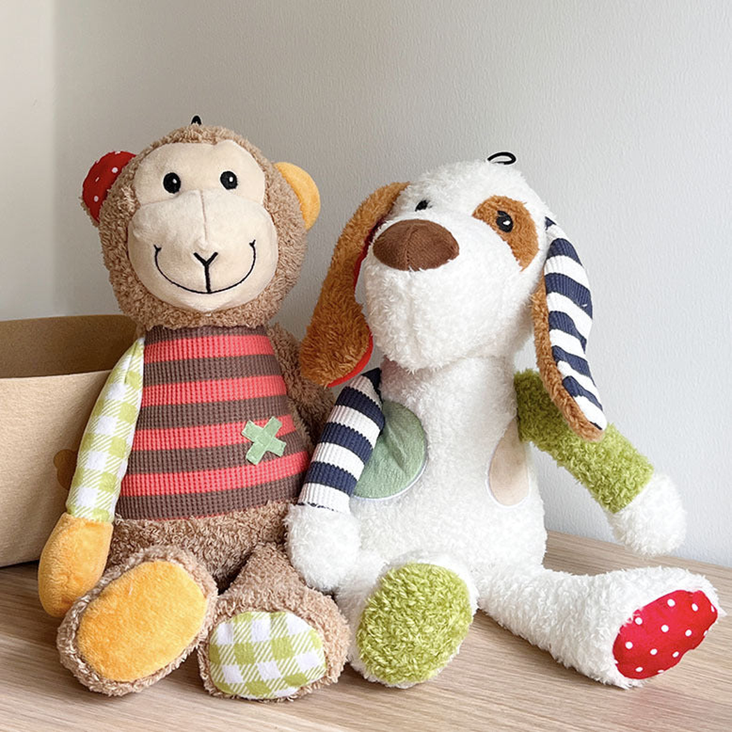 Dog and monkey character dog toys displayed together on a tabletop
