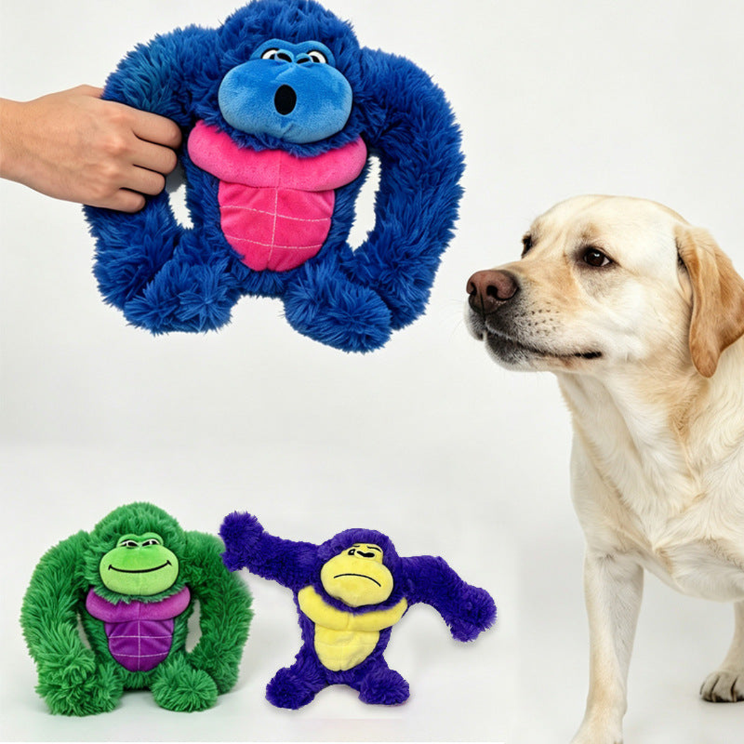 Dog beside three colorful fuzzy gorilla dog toys