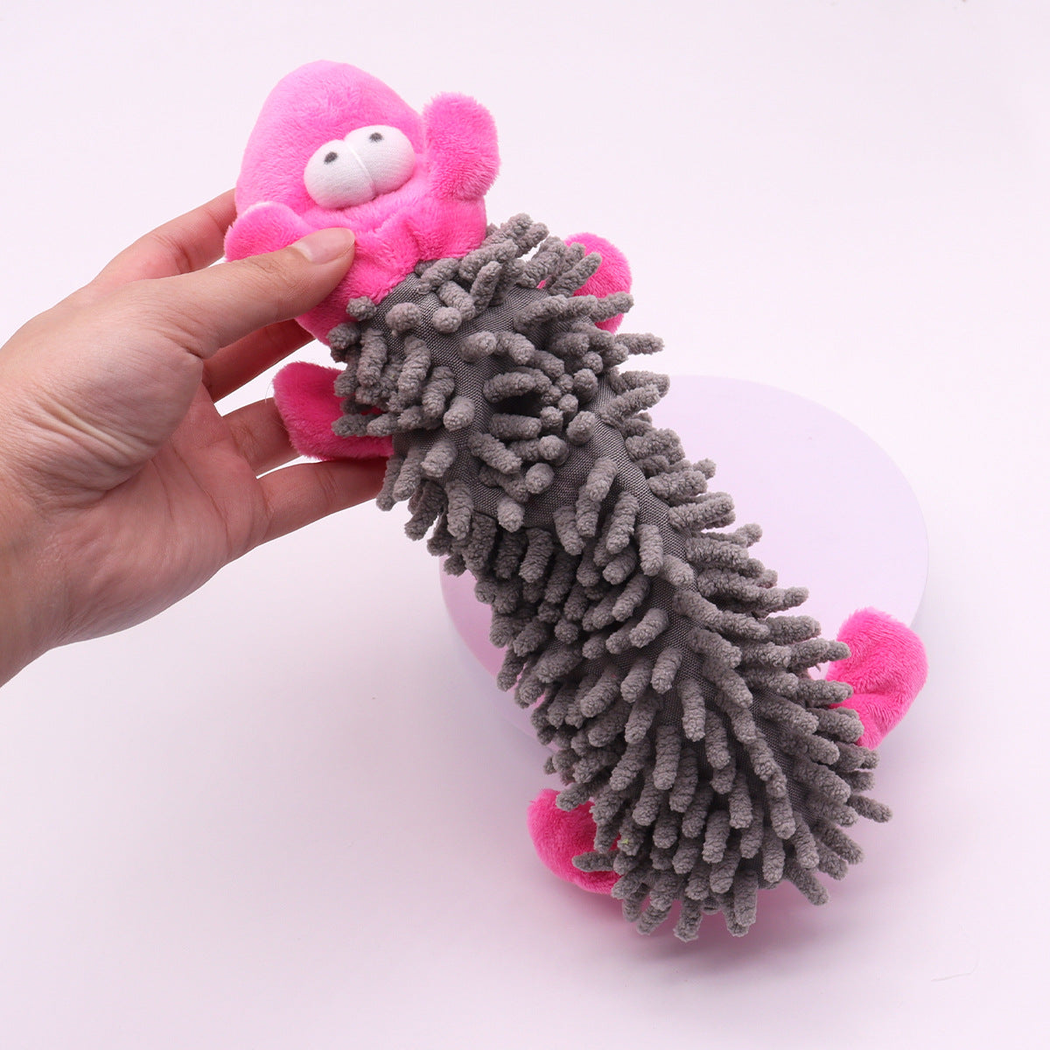 Close-up of the gray tufted body and pink character head