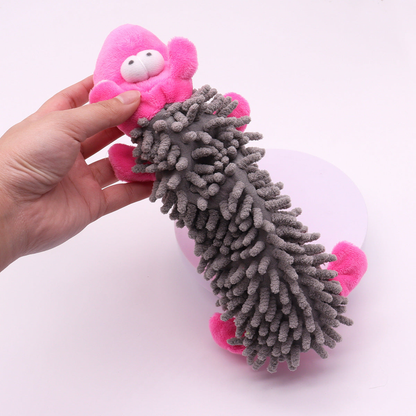 Close-up of the gray tufted body and pink character head