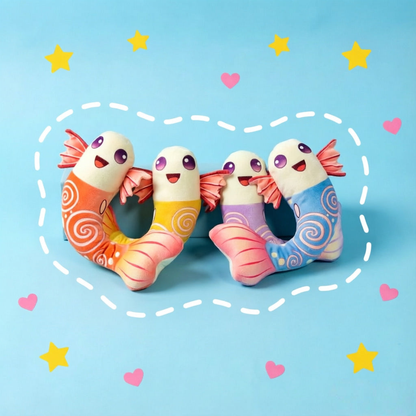 Blue, purple, orange and yellow fish-shaped dog toys arranged together