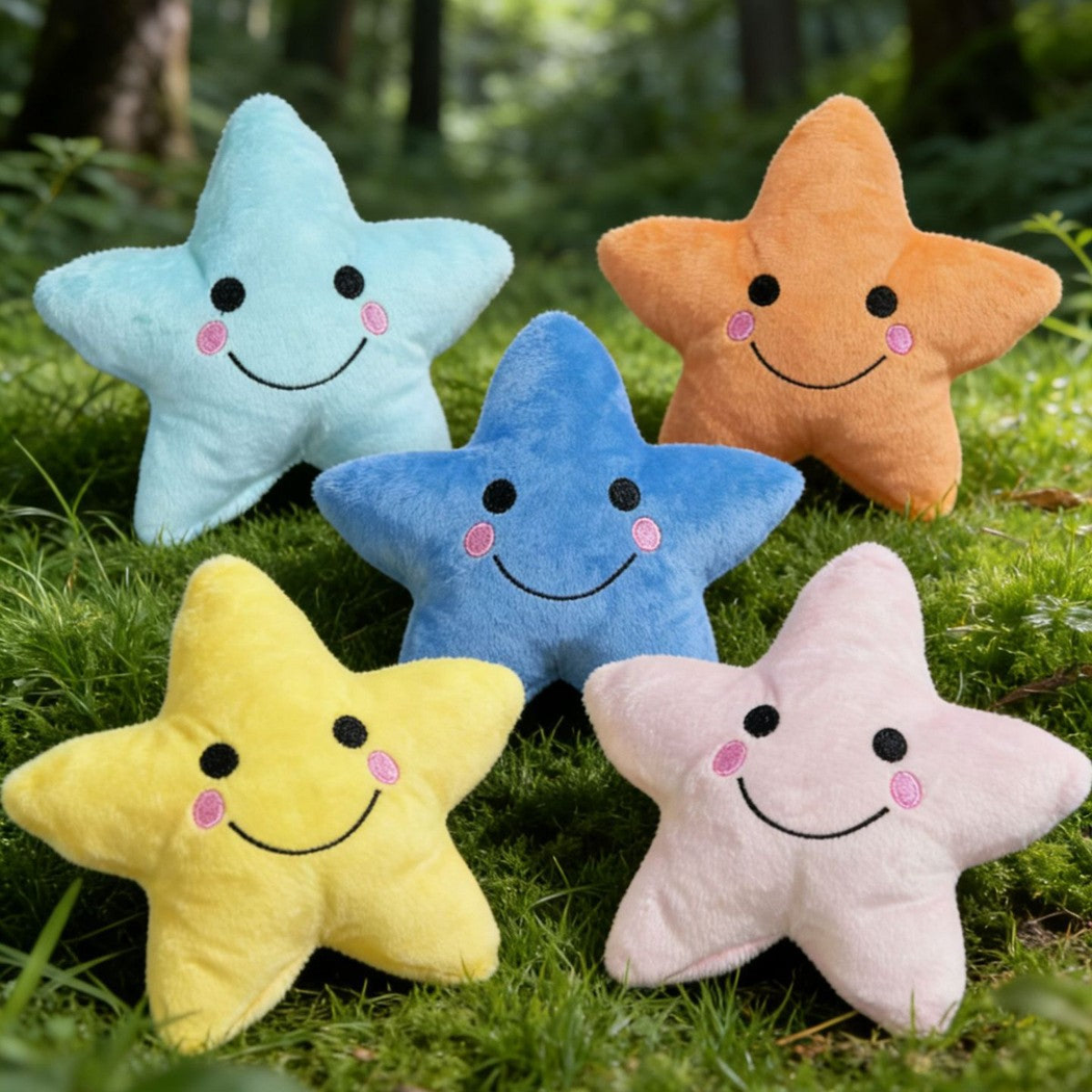 Five colorful star-shaped dog toys arranged on moss outdoors