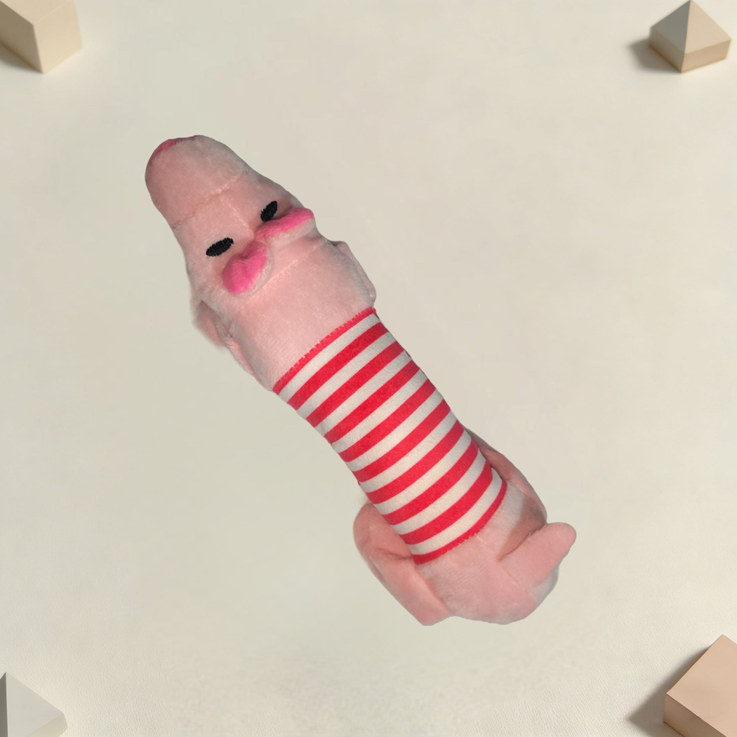 Pink moustached character dog toy in an angled view