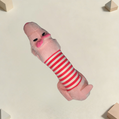 Pink moustached character dog toy in an angled view