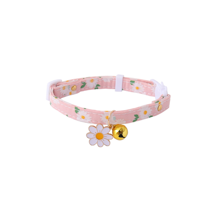 Pink daisy-print cat collar with white flower charm and gold-tone bell