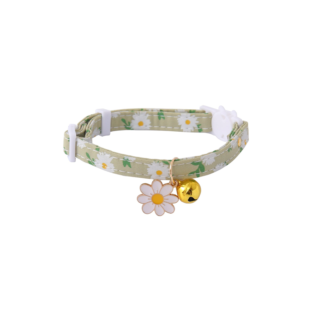 Green daisy-print cat collar with white flower charm and gold-tone bell