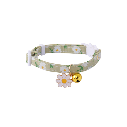 Green daisy-print cat collar with white flower charm and gold-tone bell