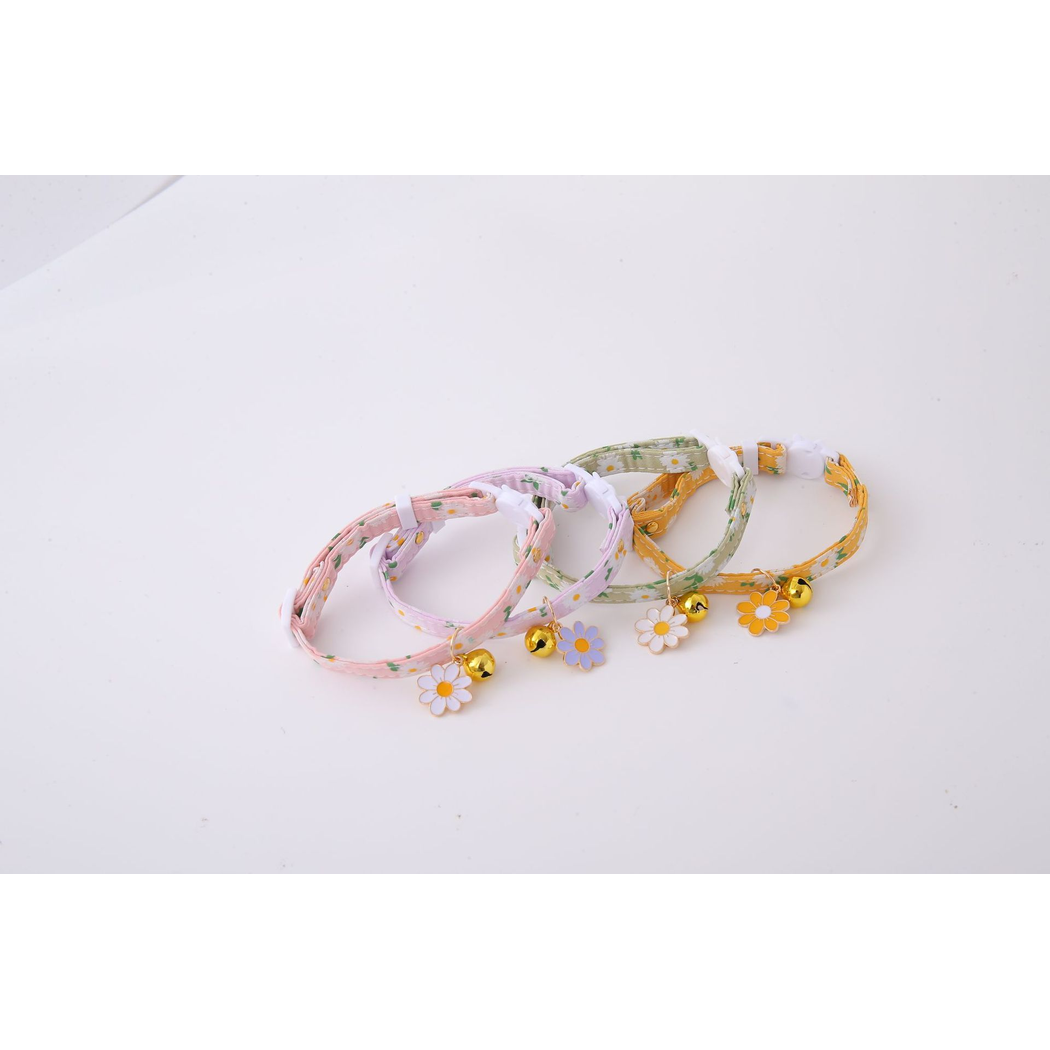 Four daisy-print cat collars arranged in a row with flower charms and bells