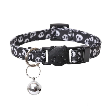 Black Bowless cat collar with white skull print, cat-face buckle, and silver-tone bell