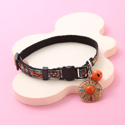Orange Sunburst multicolor cat collar with orange bell and hanging medallion