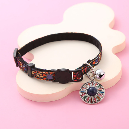Navy Sunburst multicolor cat collar with silver-tone bell and hanging medallion