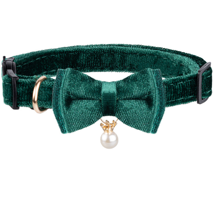 Green Bowtie cat collar with white bead charm on a white background