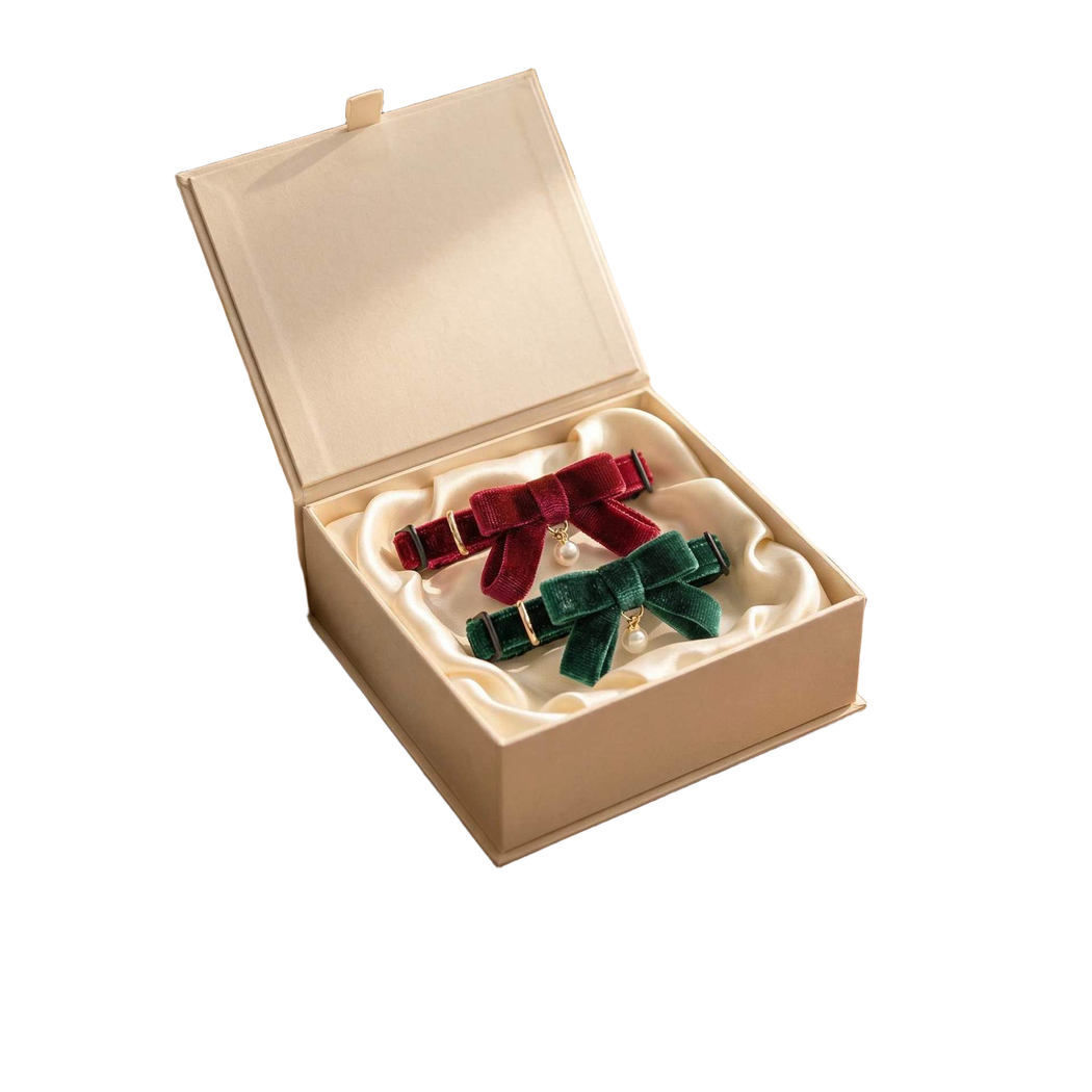 Burgundy Ribbon and Green Ribbon cat collars displayed in a presentation box