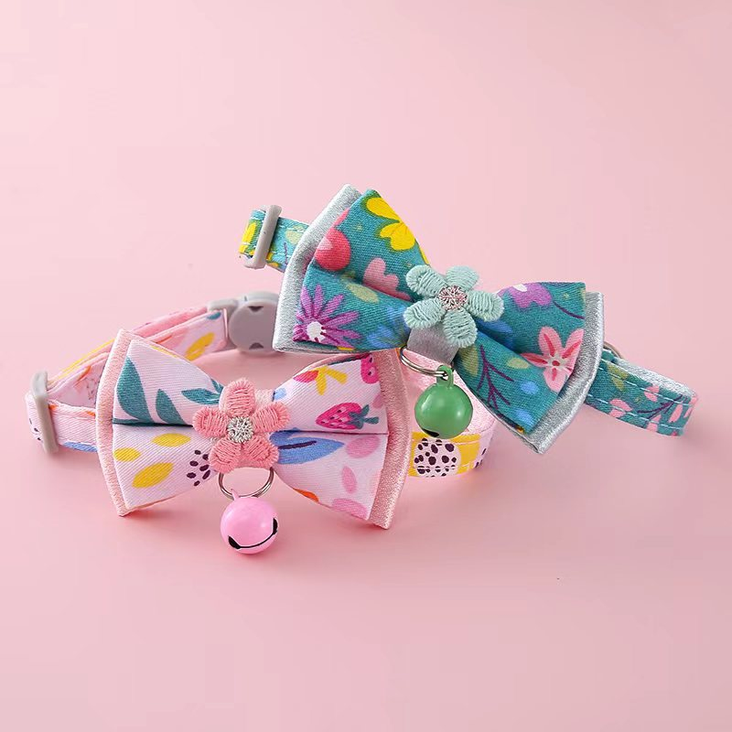 Teal Blue and Light Pink floral bow cat collars displayed together