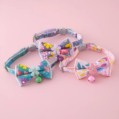 Teal Blue, Purple and Light Pink floral bow cat collars arranged together