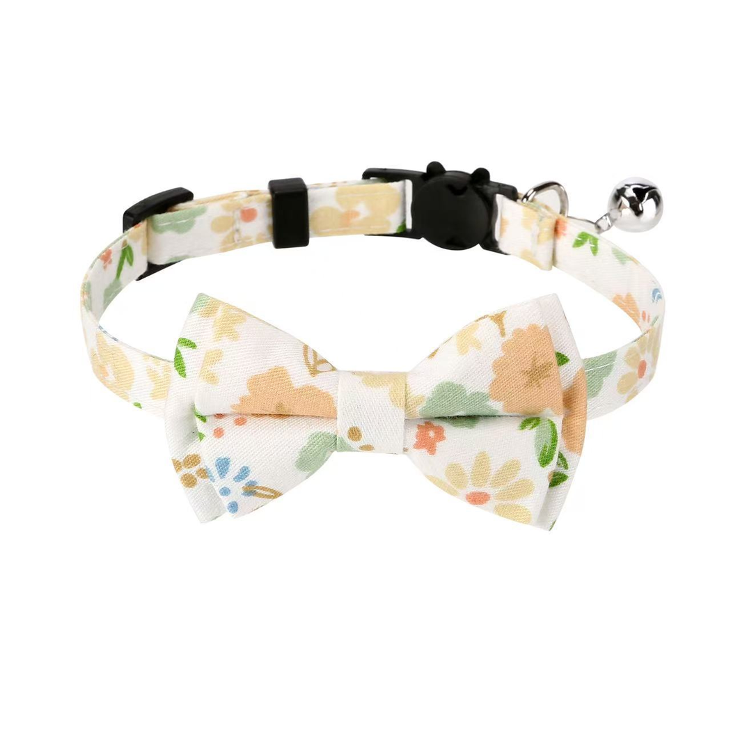 Cream Floral cat collar with bow, cat-face buckle, metal ring, and bell