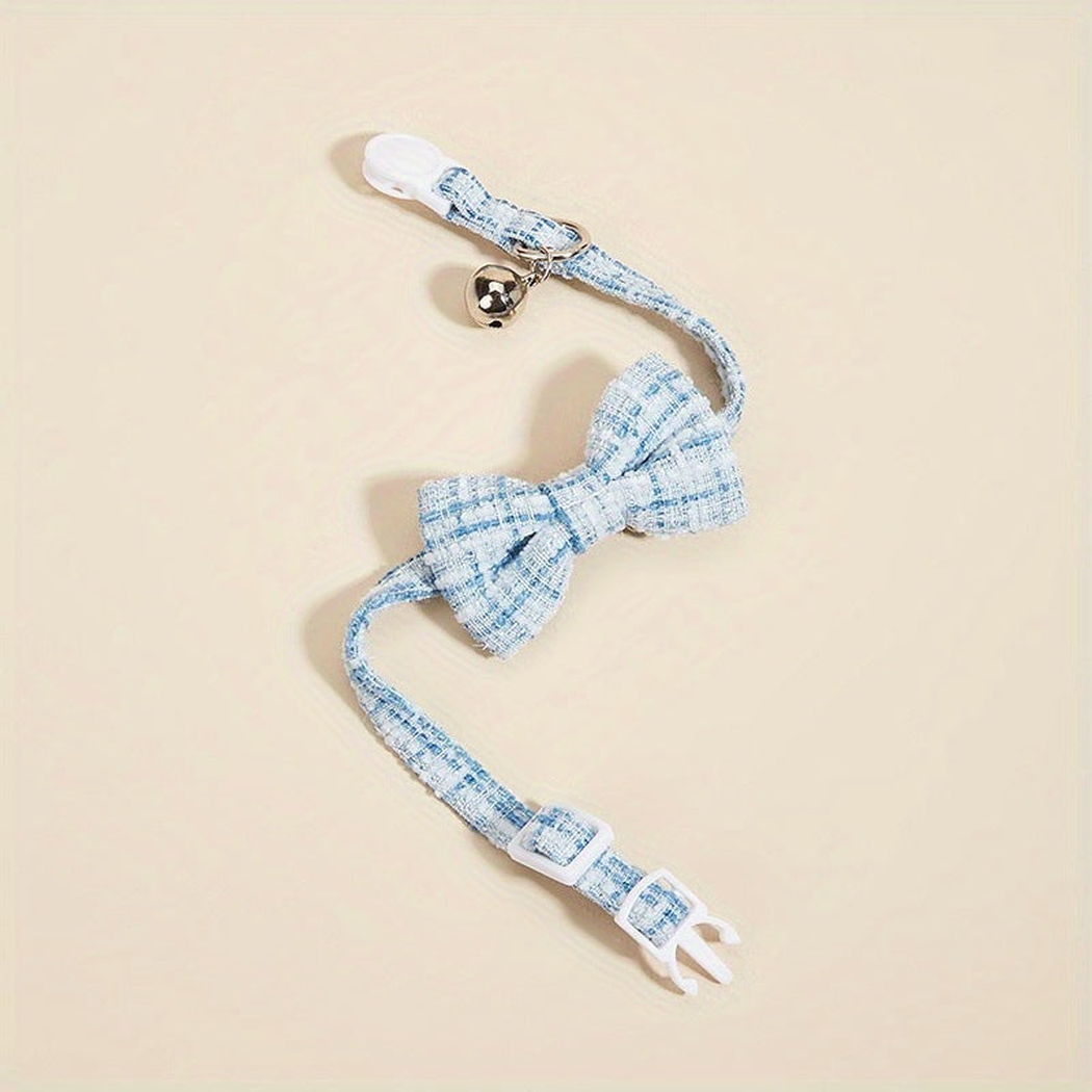 Light Blue plaid bow cat collar opened to show the buckle and adjustment slider