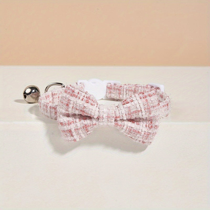 Light Pink plaid bow cat collar with silver-tone bell, front view